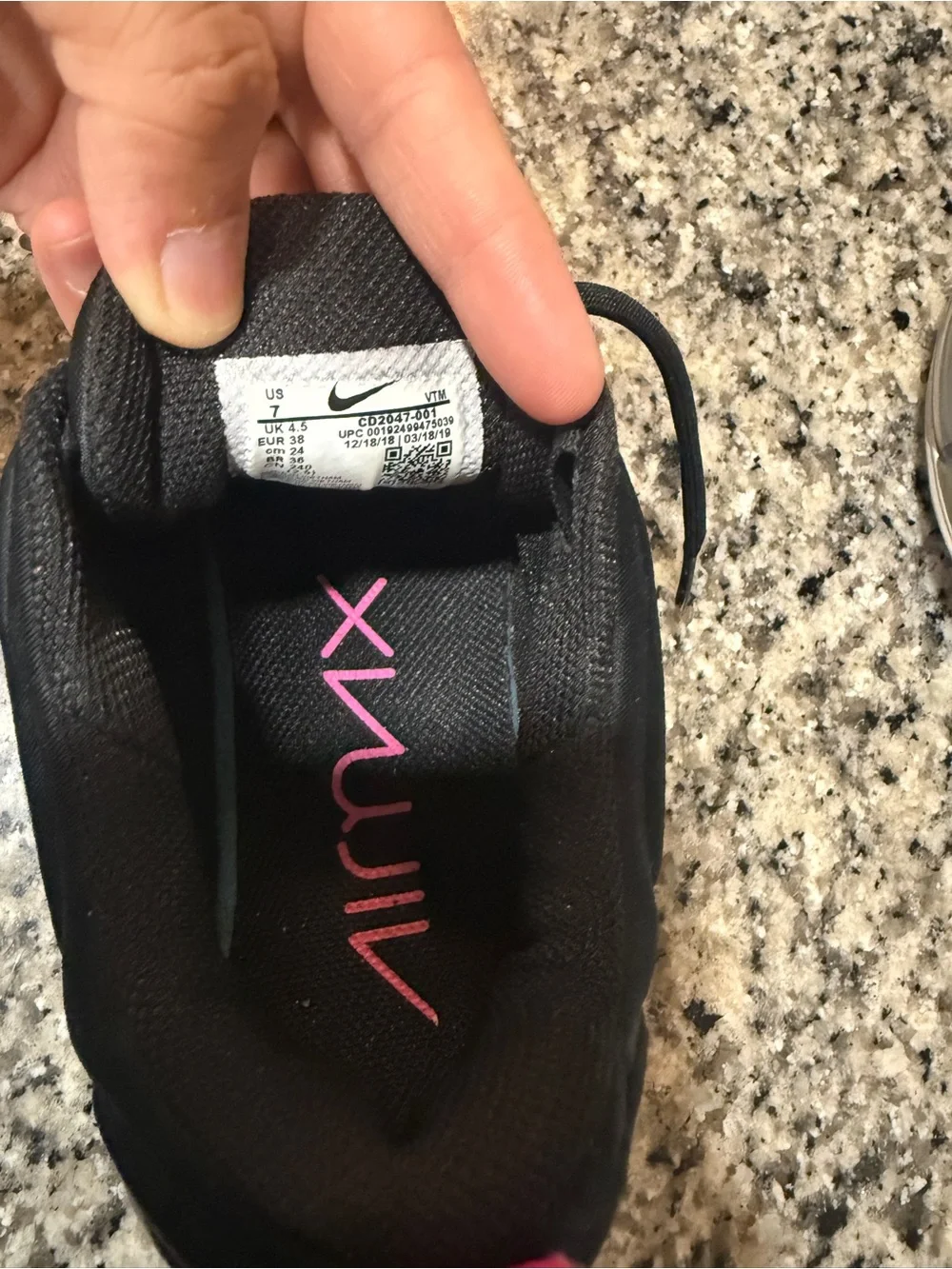 Nike Women’s Black Sneakers with Pink and Iridescent Accents